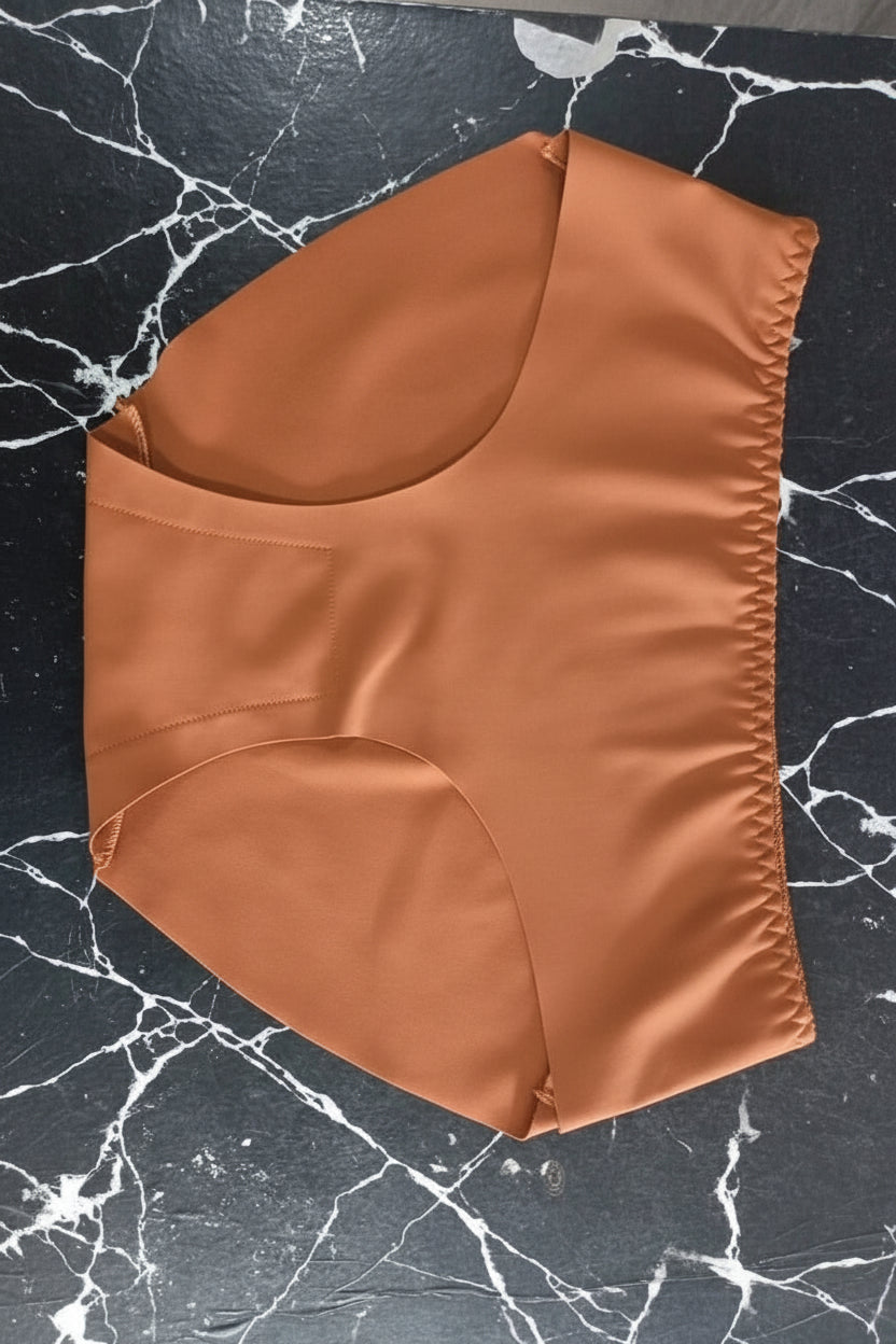 Brown fabric item on a black marble surface