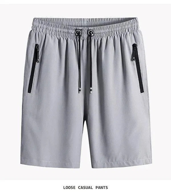 Gray loose casual pants with zippers on a white background
